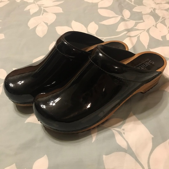 sanita black patent clogs